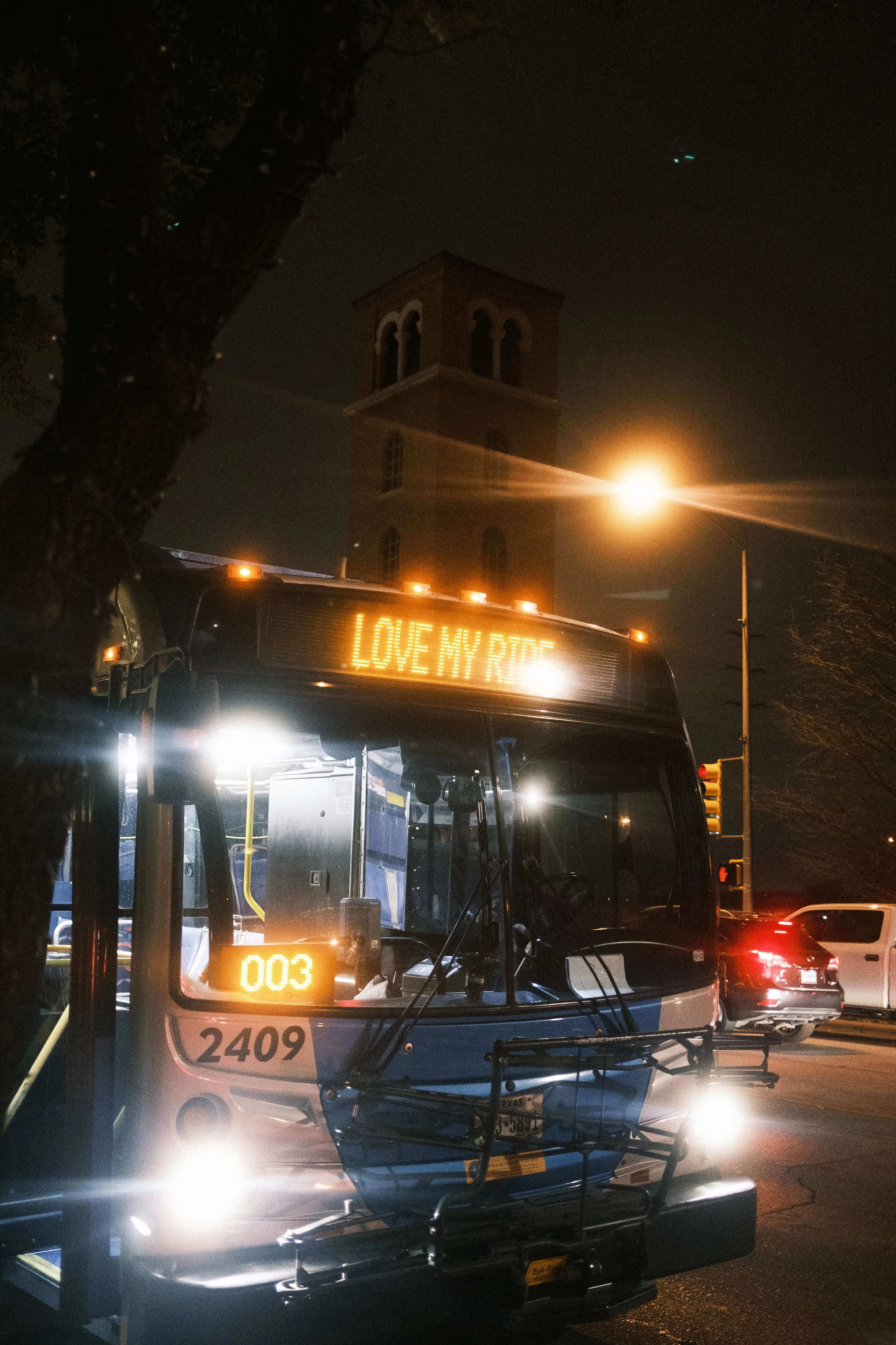 City bus at night with love my ride display austin