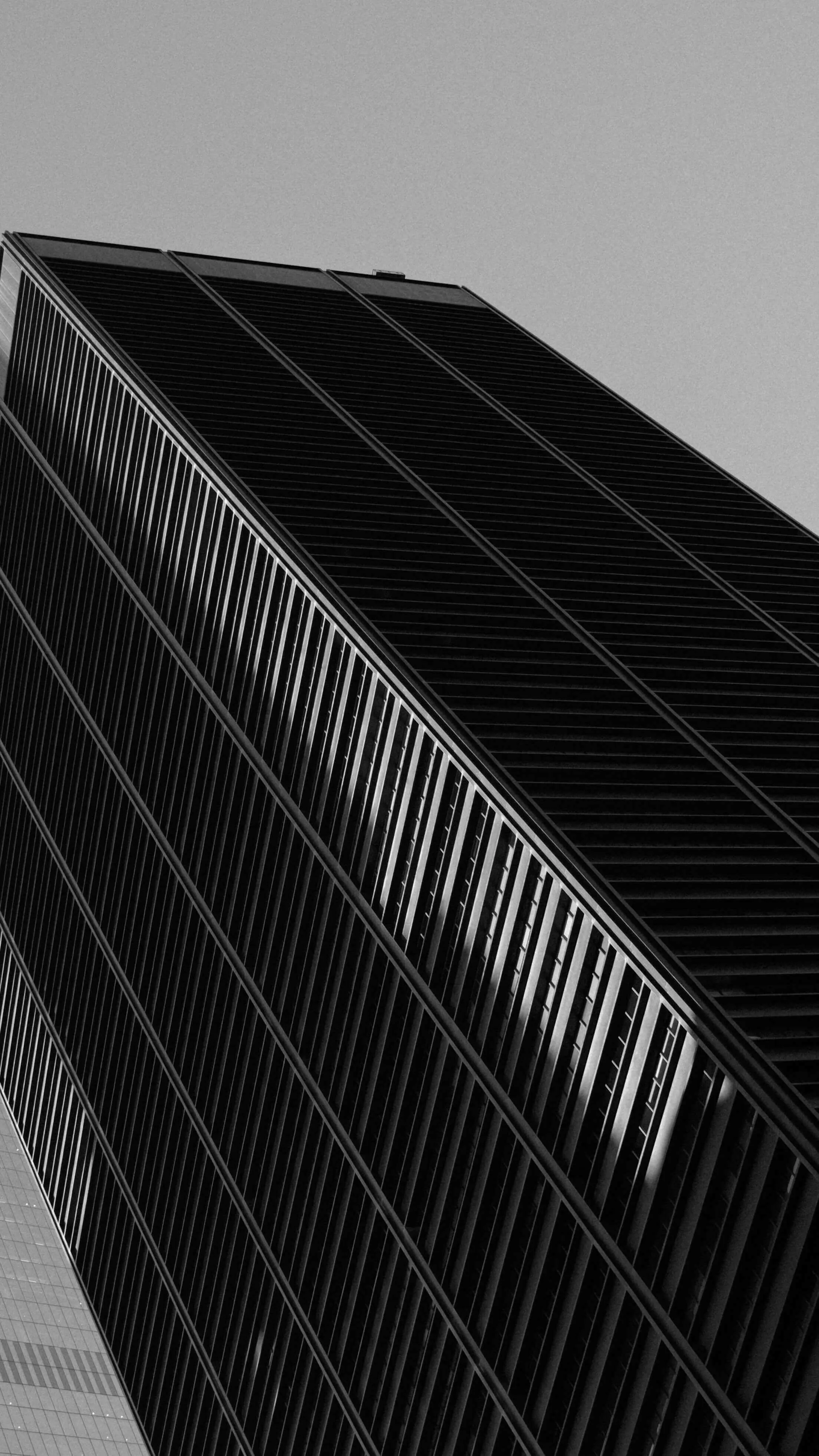 Diagonal view of modern skyscraper facade black and white new york