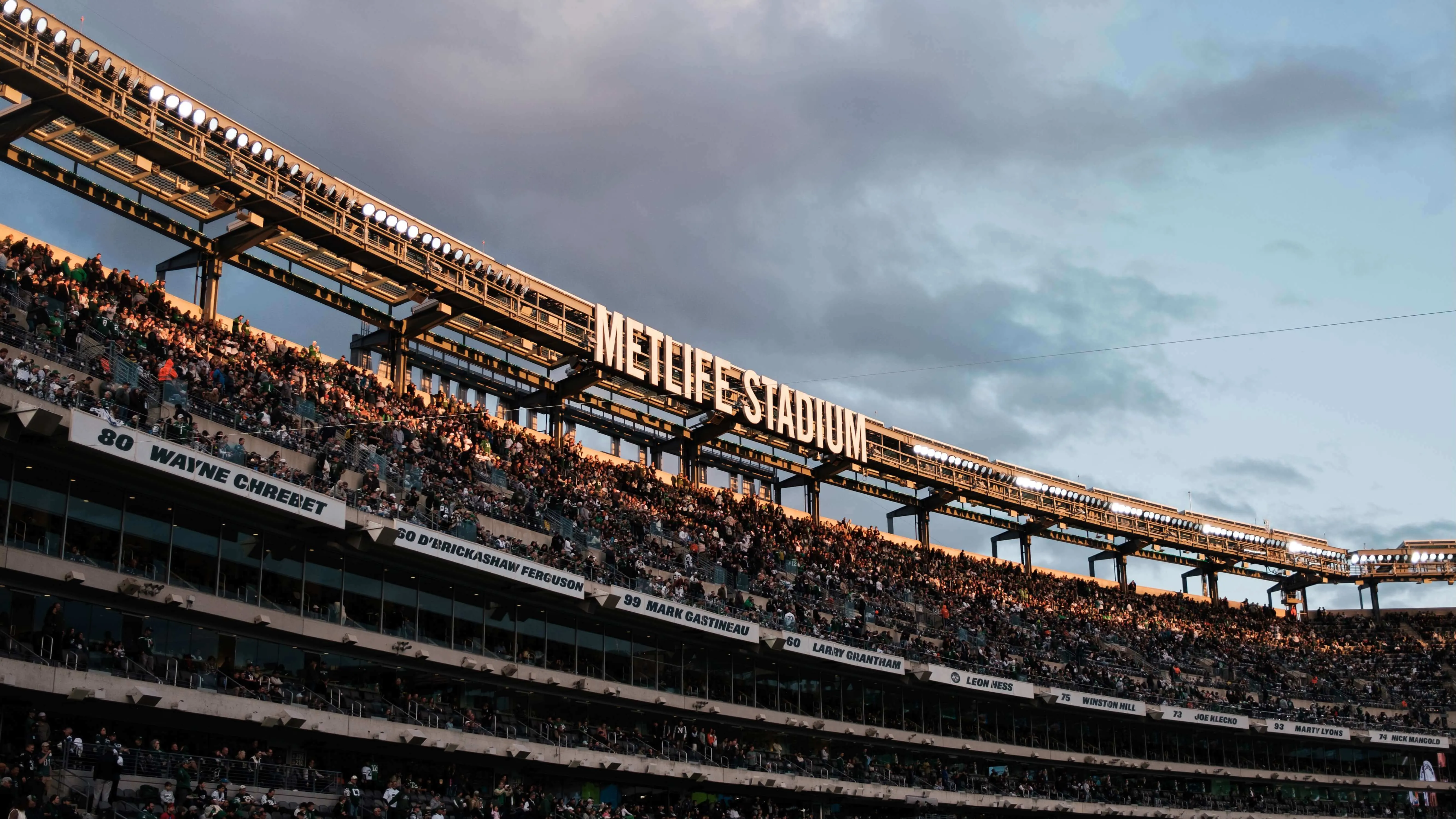 Metlife stadium stands during golden hour with crowd