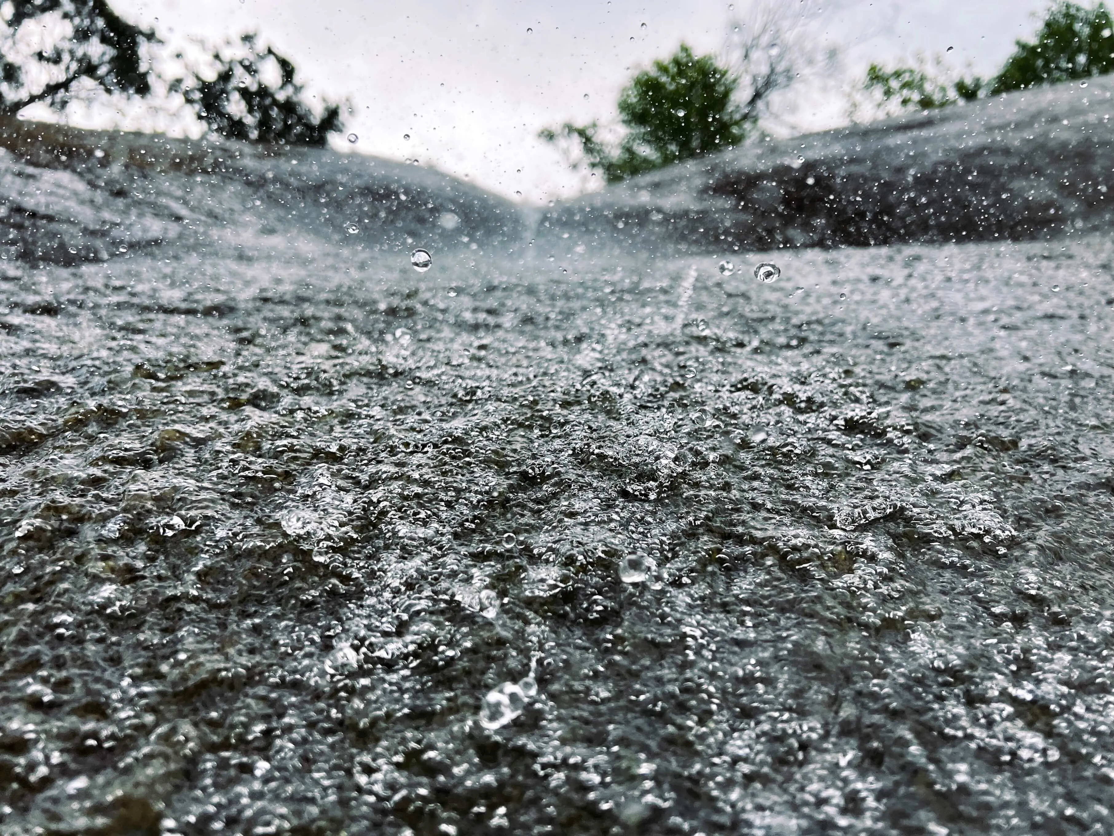 Close up water splashes and raindrops in urban vancouver setting