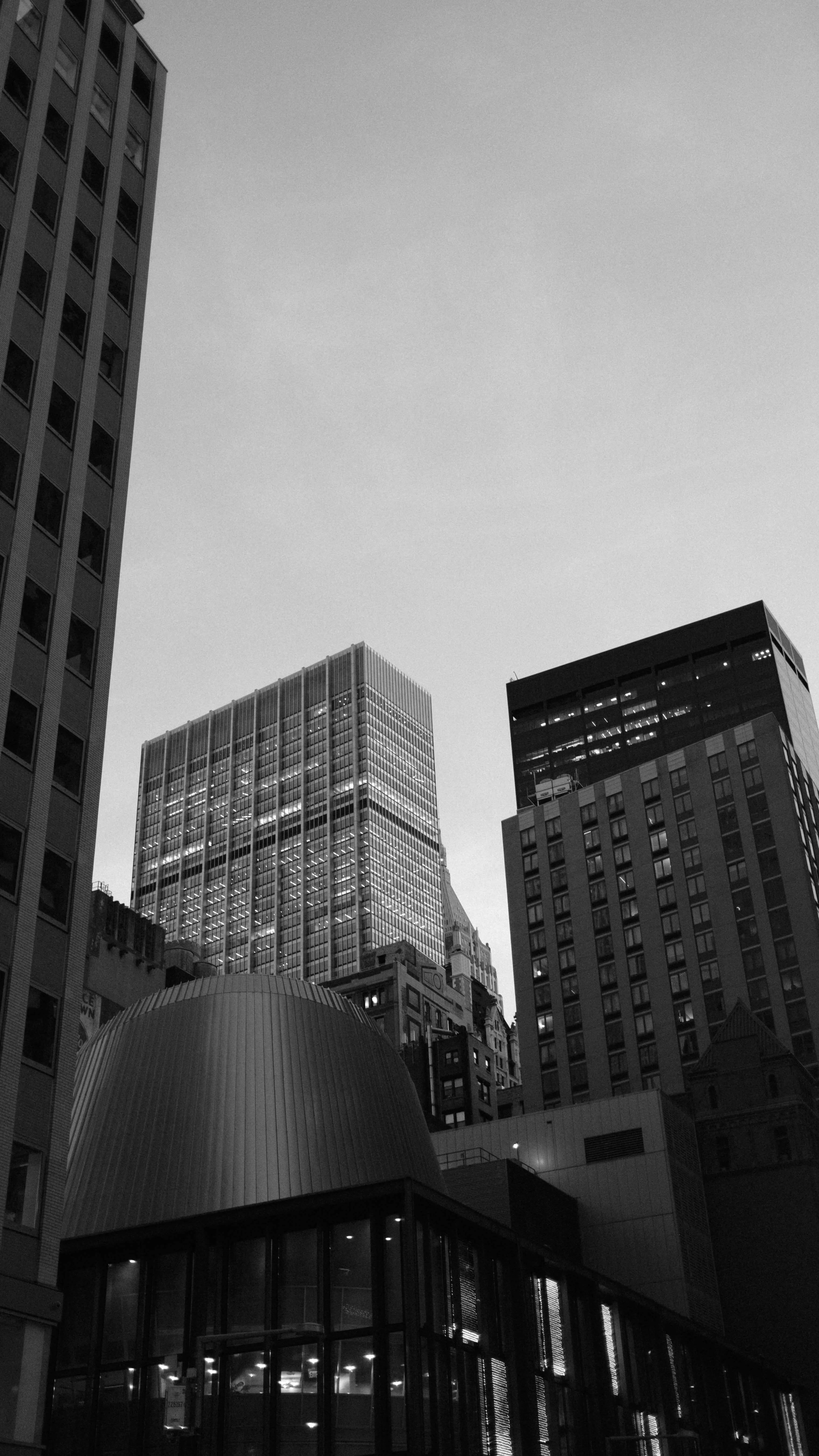 Cluster of midtown manhattan buildings at dusk black and white
