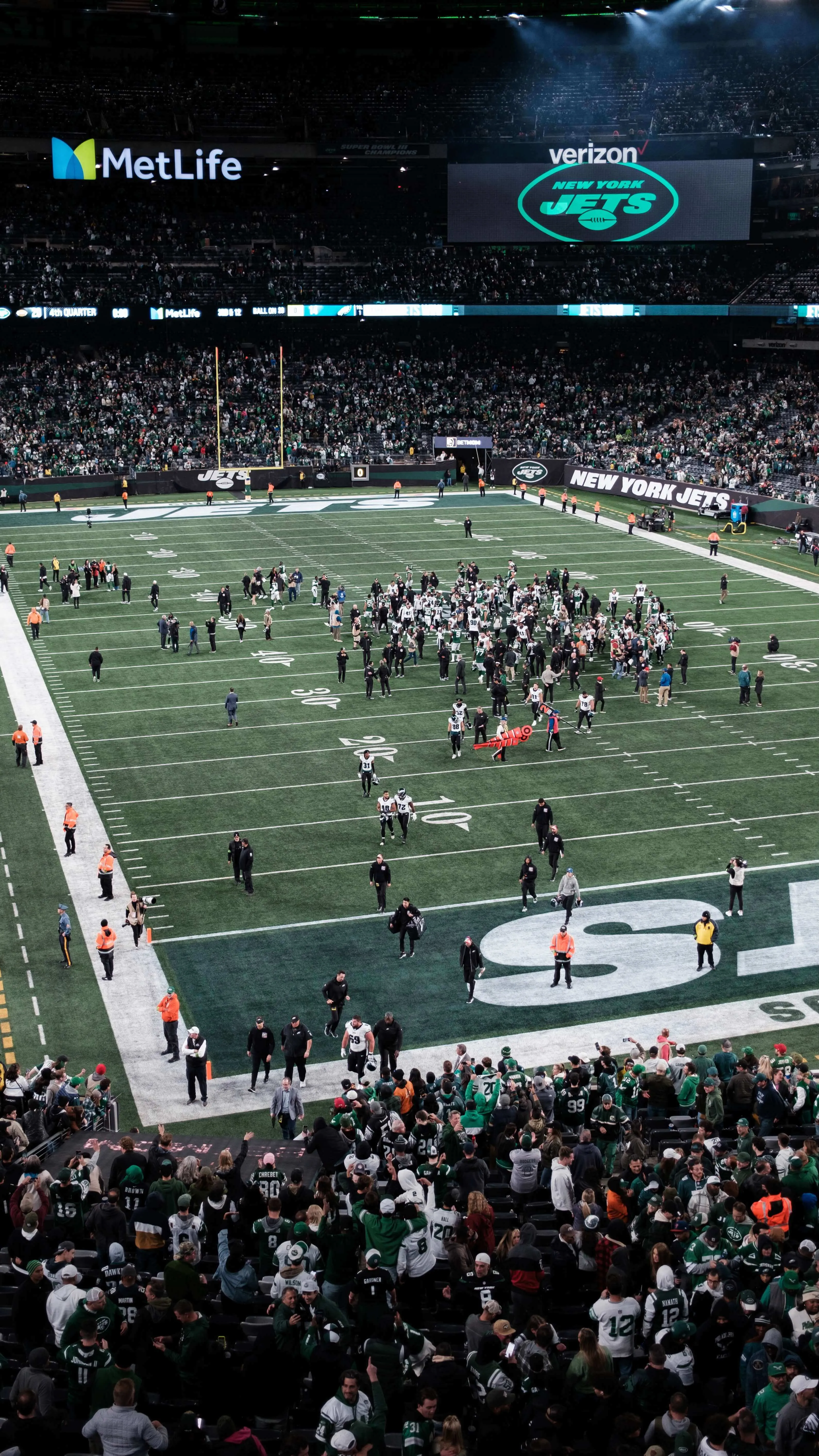Postgame crowd on field inside metlife stadium new york jets