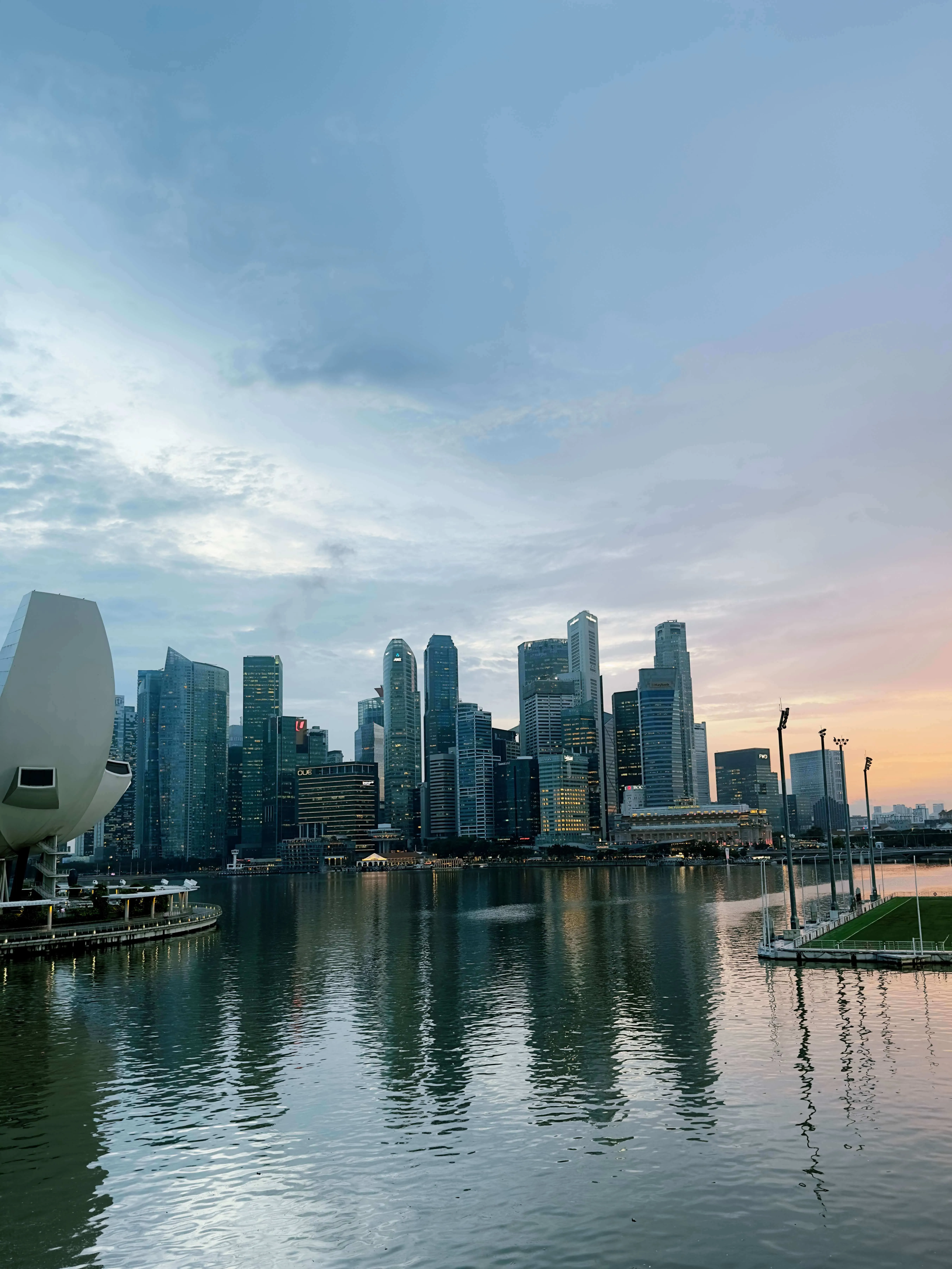 Singapore marina bay skyline early evening reflections water